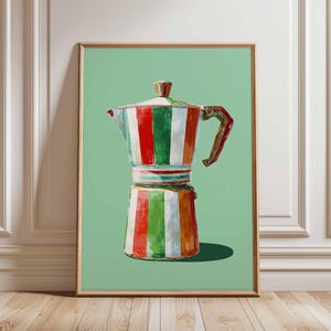 May include: A framed print of a colourful stovetop espresso maker. The coffee pot is painted with vertical stripes of red, white, green, and orange. The background is a solid light green colour.