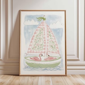 May include: Watercolor painting of a sailboat with pink and white checkered sails and floral details. Two pink flamingos are in the boat. The boat is green with blue water and a light blue sky with white clouds. The artwork is framed in a wooden frame.