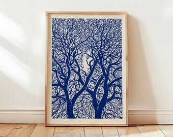 May include: A rectangular framed wall art print featuring a high-contrast, deep blue graphic illustration of dense, leafless tree branches against a solid off-white background, encased in a light-toned wooden frame with a clean, simple border.