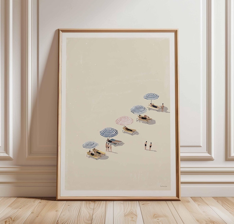 May include: Framed art print showing a beach scene with striped blue and red parasols. People are relaxing on sun loungers. The artwork has a minimalist style with a neutral colour palette.