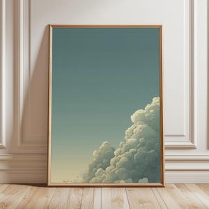 May include: A framed art print depicting a tranquil cloud scene. The image presents a gradient sky, shifting from a gentle teal to a light yellow, with voluminous white clouds in the lower right. The frame is made of warm, natural wood.