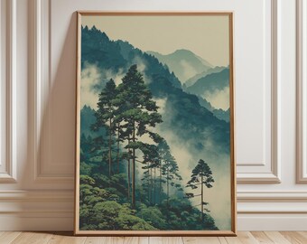 Può includere: Una stampa artistica incorniciata con un sereno paesaggio montano. L'opera raffigura alti alberi sempreverdi in primo piano, con montagne nebbiose e stratificate in tonalità di verde e blu sullo sfondo. La stampa è racchiusa in una cornice di legno marrone chiaro.