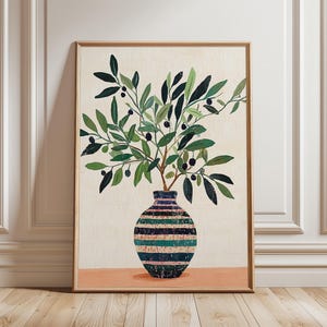 Può includere: Una stampa artistica incorniciata con un vaso a righe, contenente rami di ulivo con foglie verdi e olive nere. L'opera d'arte è ambientata su uno sfondo color crema e una base color pesca.