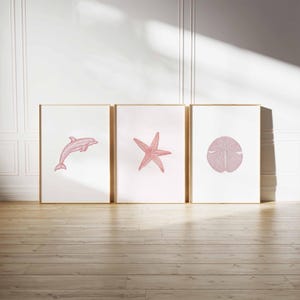 Set of 3 Pink Coastal Wall Art Prints, Dolphin Starfish Sand Dollar Poster Set, Minimal Ocean Beach Bathroom Decor, Soft Nautical Print Trio