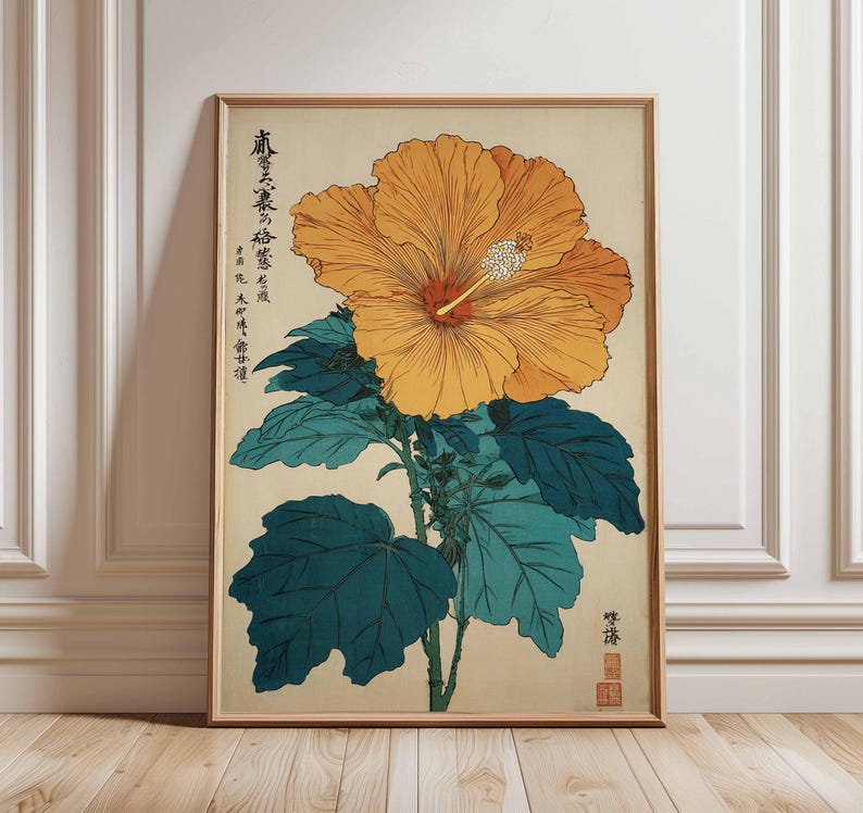 May include: A framed botanical print of a large orange hibiscus flower with a red center and white stamen. The flower is set against a beige background with teal leaves and stems. Japanese text is visible on the top left of the print.