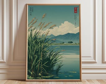 May include: A framed art print featuring a serene landscape with a lake, mountains, and tall green reeds. The artwork has a vintage aesthetic with soft colors, including shades of blue, green, and beige. The print is displayed in a wooden frame.