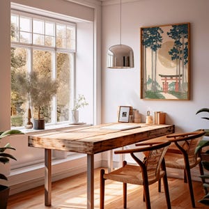 May include: A home office with a large wooden desk and two chairs. A framed Japanese-style print hangs on the wall. A large window provides natural light. The room is decorated with plants and a modern pendant light.