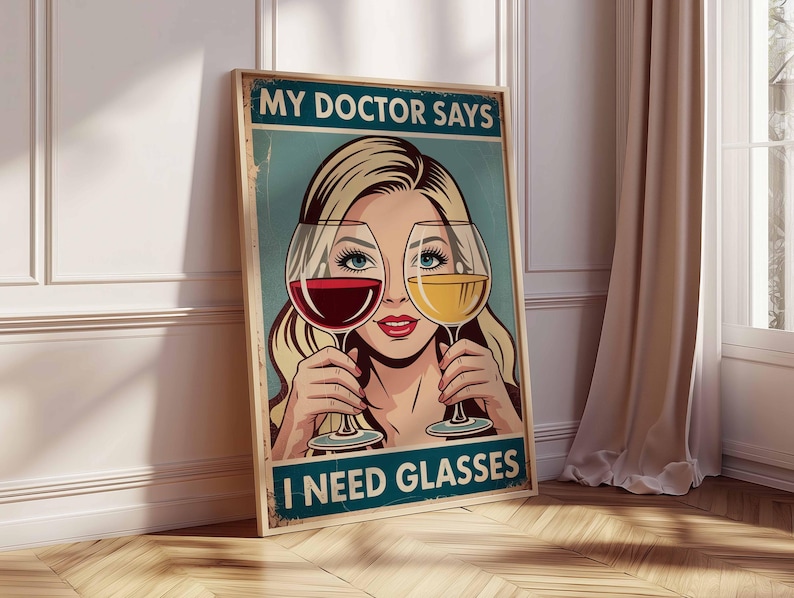May include: A framed vintage-style poster with the text "MY DOCTOR SAYS I NEED GLASSES." The artwork features a blonde woman holding a glass of red wine in front of one eye and a glass of white wine in front of the other.