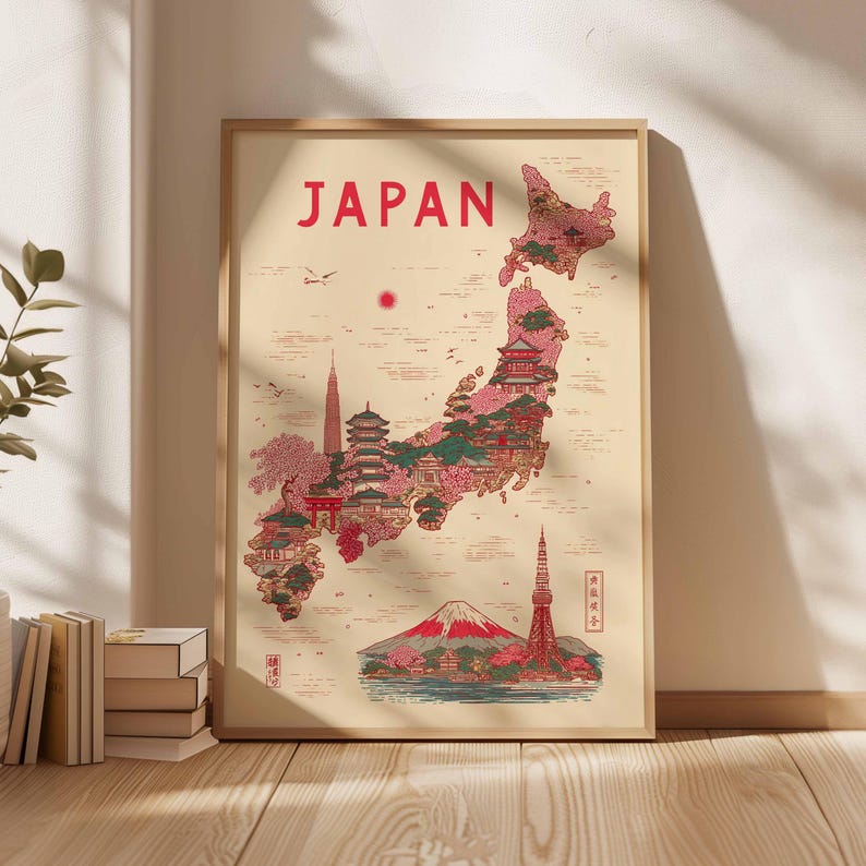 May include: A framed art print featuring a map of Japan with illustrations of landmarks and cherry blossoms. The word "JAPAN" is printed in red at the top. The map is filled with pink, green, and red details, and is set against a beige background.