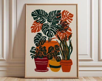 May include: A framed art print featuring a colorful illustration of potted plants. The artwork showcases various plants with large green and orange leaves in red, yellow, and orange pots. The background is a cream color.