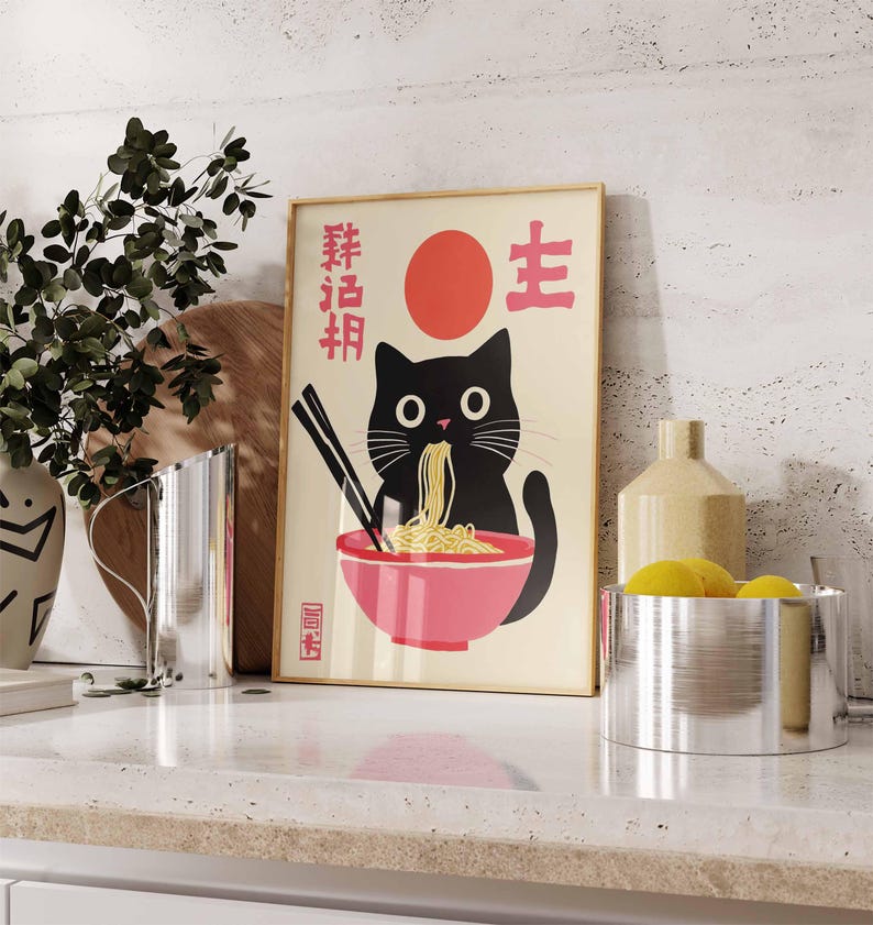May include: A black cat with a red circle and Japanese characters on a white background. The cat is eating noodles from a pink bowl. The text on the poster reads "Fresh Noodles" and "Life".