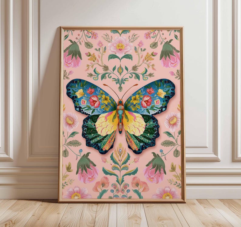 May include: A framed art print featuring a colorful butterfly with floral patterns. The butterfly has blue, yellow, and green wings, set against a pink background with floral and leaf motifs. The artwork is in a wooden frame.