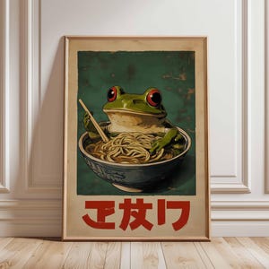 Frog Eating Noodles Poster – Japanese-Inspired Animal Art, Cute Frog with Ramen, Cartoon Frog Wall Art, Fun Kitchen Decor