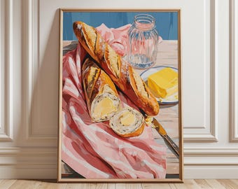 Puede incluir: Una impresión artística enmarcada que presenta una naturaleza muerta de una baguette, mantequilla y un tarro de cristal. La baguette está cortada y untada con mantequilla, sobre un paño a rayas rosas. Un cuchillo y una porción de mantequilla en un plato completan la escena.
