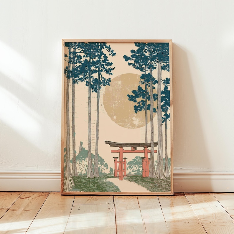 May include: Framed art print featuring a Japanese landscape with a red torii gate, a path, and tall trees with blue-green foliage. A large, pale yellow sun is in the background. The artwork is in a wooden frame.