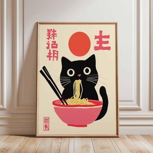May include: A black cat with a red circle and Japanese characters on a cream background. The cat is eating noodles from a pink bowl with chopsticks. The Japanese characters say "Ramen Master".