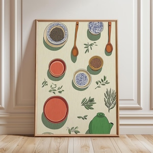 May include: A framed art print depicting a still life of kitchen items. The artwork includes bowls, spoons, herbs, and a green teapot. The bowls are in shades of red, brown, and blue, with the spoons and teapot in brown and green.