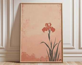 May include: Framed art print featuring a stylized iris flower in shades of orange and black against a peach-colored background. The artwork has a minimalist design with a textured, vintage aesthetic, suitable for home decor.