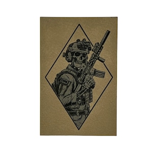 May include: A black and white illustration of a skeleton soldier wearing a helmet and holding a rifle. The illustration is set against a brown diamond-shaped background.