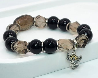 Bracelet made of natural stones. Agate, smoky quartz