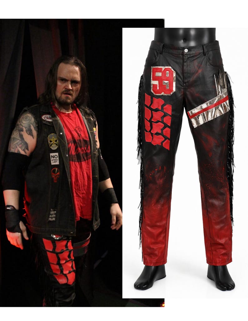 May include: Black and red pants featuring a metallic silver number 59 patch on the right hip, a red tire tread pattern on the right leg, a silver diagonal stripe on the left hip, and long black fringe trim along the outer seams of both legs.