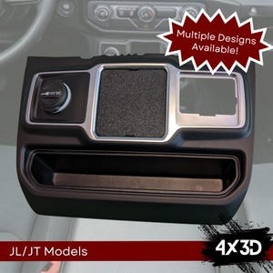 May include: Black plastic car interior accessory with a silver trim and a 12V DC outlet. The accessory has a small tray with a textured surface and a larger tray with a smooth surface. The text "4x3D" is visible in the lower right corner of the image. The text "JL/JT Models" is visible in the lower left corner of the image.