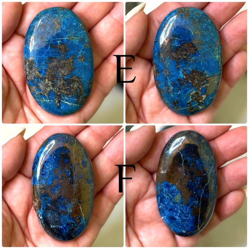 May include: Four polished, oval-shaped stones with a vibrant blue hue and intricate brown and gold veining. The stones are held in a hand, showcasing their natural beauty and unique patterns. Each stone has a glossy finish.