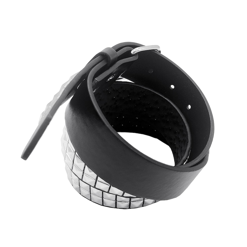 May include: A black leather belt with silver pyramid-shaped studs. The belt is rolled up and the buckle is visible.