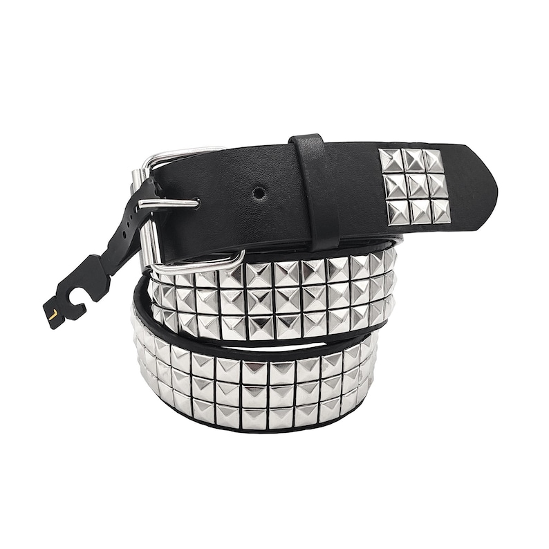 May include: A black leather belt with silver pyramid-shaped studs. The belt is rolled up and the buckle is visible.