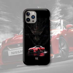 May include: Black phone case featuring a red sports car design. The case has a glossy finish and a detailed illustration of a car with a dark background. The Nissan logo is at the bottom.
