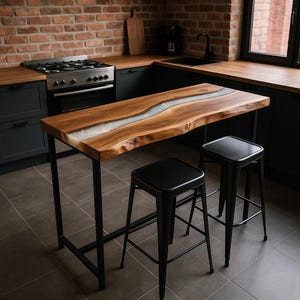 May include: A rectangular high-top table featuring a natural live-edge wood slab with a central translucent white resin river inlay, supported by a black metal frame, accompanied by two matching black metal stools with square seats and four legs.