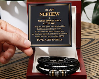 May include: A black leather bracelet set inside a wooden gift box. The bracelet has a magnetic clasp with the words "love you forever". A card reads "To Our Nephew, Never Forget That I Love You."
