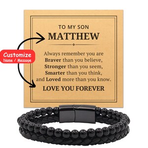 May include: A black leather bracelet with black beads and a silver clasp. The bracelet comes with a card that says "To My Son Matthew Always remember you are Braver than you believe, Stronger than you seem, Smarter than you think, and Loved more than you know. Love You Forever".
