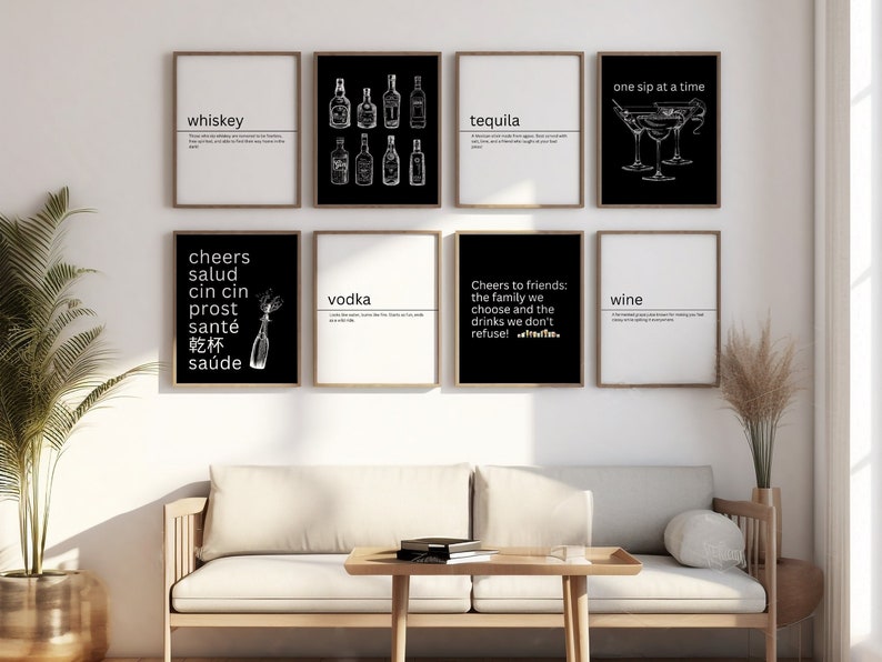 May include: A set of eight black and white prints with various quotes and illustrations related to alcoholic beverages. The prints include the words "whiskey", "tequila", "vodka", "wine", "cheers", "salud", "cin cin", "prost", "sant&eacute;", "乾杯", "sa&uacute;de", and "one sip at a time".