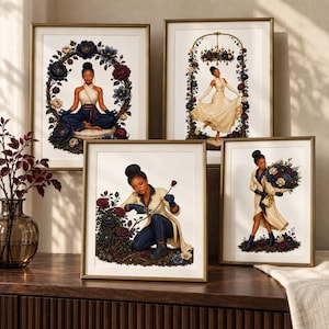 May include: Four framed art prints featuring a Black individual in various scenes with dark blue and burgundy floral motifs. One shows a person meditating, another dancing under a chandelier, one pruning roses, and one holding a large floral bouquet.