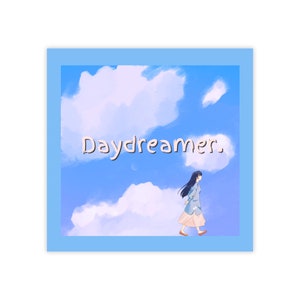 May include: Square print featuring a blue sky with fluffy white clouds and the word "Daydreamer." A cartoon figure in a light blue coat and peach skirt walks across the bottom. The print is framed in a light blue border.