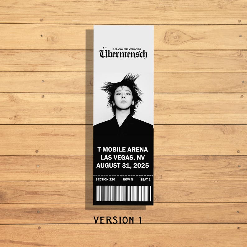 May include: A black and white concert ticket for the G-Dragon 2025 World Tour. The ticket features a portrait of the artist and includes the venue, T-Mobile Arena in Las Vegas, NV, and the date, August 31, 2025. The ticket also has a barcode and reads "Version 1".
