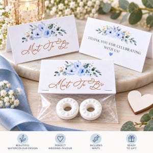 May include: Three white rectangular paper cards featuring a blue watercolour floral design. Two cards display the copper-coloured text Mint To B with a small heart, while one card reads THANK YOU FOR CELEBRATING WITH US! A clear plastic bag contains two white mints.