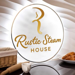 May include: A circular sign with the words "Rustic Steam House" in gold script. The sign has a gold border and a gold stylized "R" logo. A wicker basket, rolling pin, and a white cup are in the foreground. Croissants are on a white plate.