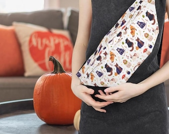 May include: A white fanny pack with a black strap, featuring a repeating pattern of Halloween cats in various costumes. The cats are in shades of brown, black, and orange, with pumpkins and other festive elements.