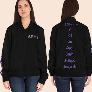 May include: Black bomber jacket with purple text that reads "ARMY" on the front and "I Stan..." followed by names on the back. The jacket has a zipper closure and purple accents on the sleeves.