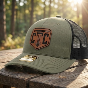 May include: A set of three ceramic mugs with a speckled, matte finish. The mugs are in shades of cream, light gray, and dark gray. Each mug has a simple, modern design and a rounded handle. Perfect for coffee or tea.