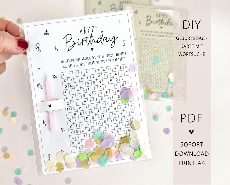 May include: A clear plastic sleeve containing a DIY birthday card with a word search puzzle. The card features the words "Happy Birthday" in elegant script, with confetti scattered around. The card also has the text "DIY Geburtstagskarte mit Wortsuche".
