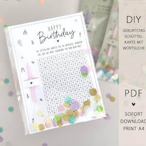 May include: A clear plastic bag containing a birthday card with a word search puzzle and confetti. The card has the words "Happy Birthday" and German text. The bag also contains a pink candle and colorful confetti.