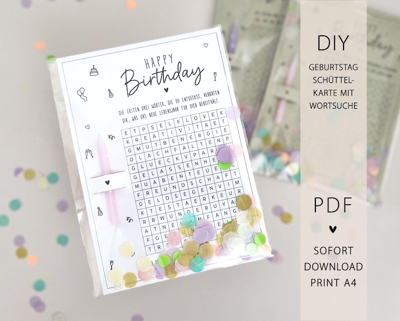 May include: A clear plastic bag containing a birthday card with a word search puzzle and confetti. The card has the words "Happy Birthday" and German text. The bag also contains a pink candle and colorful confetti.
