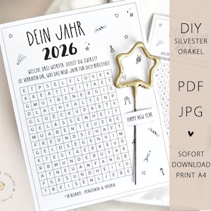 Op de afbeelding: Zwart-wit printbaar Nieuwjaarsorakelspel met een stervormige topper. Het spel bevat een woordzoekpuzzel met de tekst "DEIN JAHR 2026" en "HAPPY NEW YEAR". Het ontwerp bevat kleine illustraties en de woorden "DIY SILVESTER ORAKEL".