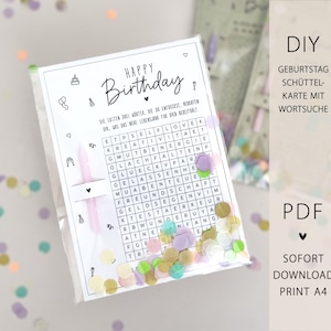 May include: A clear plastic bag containing a birthday-themed word search card with confetti. The card has the words "Happy Birthday" and a word search grid. The background is white with scattered confetti in various colors.