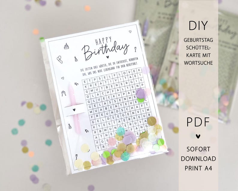 May include: A clear plastic bag containing a birthday-themed word search card with confetti. The card has the words "Happy Birthday" and a word search grid. The background is white with scattered confetti in various colors.