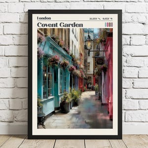 May include: A framed print featuring a colorful street scene in Covent Garden, London. The image showcases buildings with teal, pink, and red facades, adorned with flowers and plants. The text "London Covent Garden" is at the top.