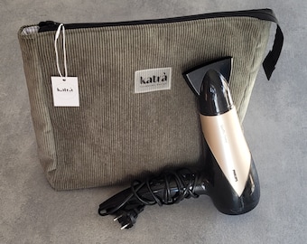 May include: A green corduroy zippered pouch with a white tag that says "katra" and a black and gold hair dryer with the brand name "PHILIPS" on it.